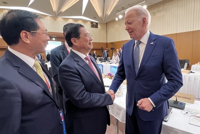 Prime Minister Pham Minh Chinh greets United States President Joe Biden during the expanded G7 Summit in Hiroshima, Japan. Photo courtesy of Vietnam News Agency.