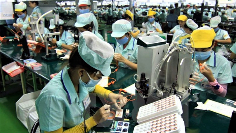 Workers at an electronics production factory in Vietnam. Photo courtesy of Voice of Vietnam. 