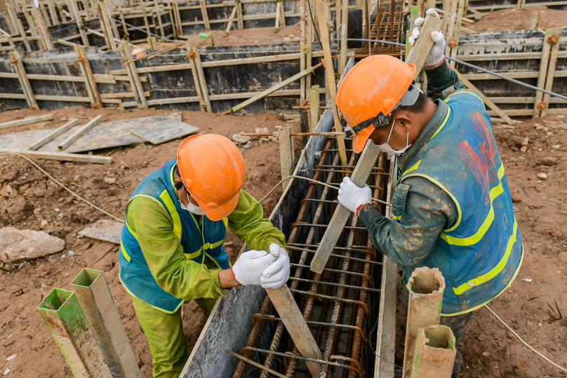 Two workers at a construction site in Hanoi, northern Vietnam. Photo by The Investor/Trong Hieu.