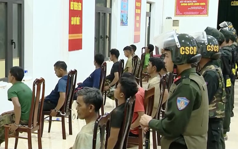 People suspected of attacking the headquarters of the people's committees of Ea Ktur and Ea Tieu communes, Cu Kuin district, Dak Lak province, Vietnam's Central Highlands at a police station. Photo courtesy of Vietnam Television.