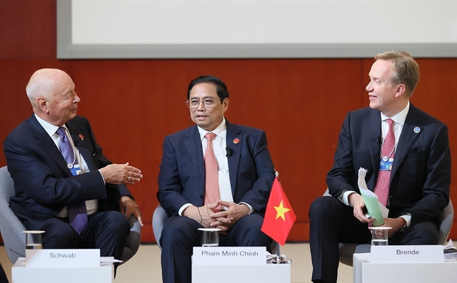 Prime Minister Phạm Minh Chính (center), WEF founder and executive chairman Klaus Schwab (left) and WEF president Børge Brende exchange views at the WEF’s Country Strategic Dialogue on Vietnam in Tianjin, China on June 26, 2023. Photo courtesy of Vietnam News Agency.