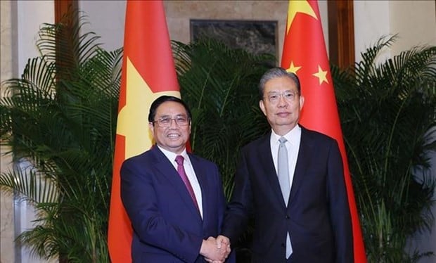 PM Pham Minh Chinh (left) and Chairman of the Standing Committee of the National People's Congress (NPC) of China Zhao Leji during their meeting in Beijing on June 23, 2023. Photo courtesy of Vietnam News Agency.