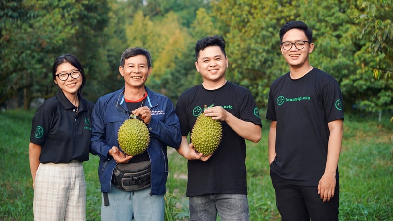 Representatives of FoodMap pose for picture with Vietnamese durian fruit. Photo courtesy of the firm.
