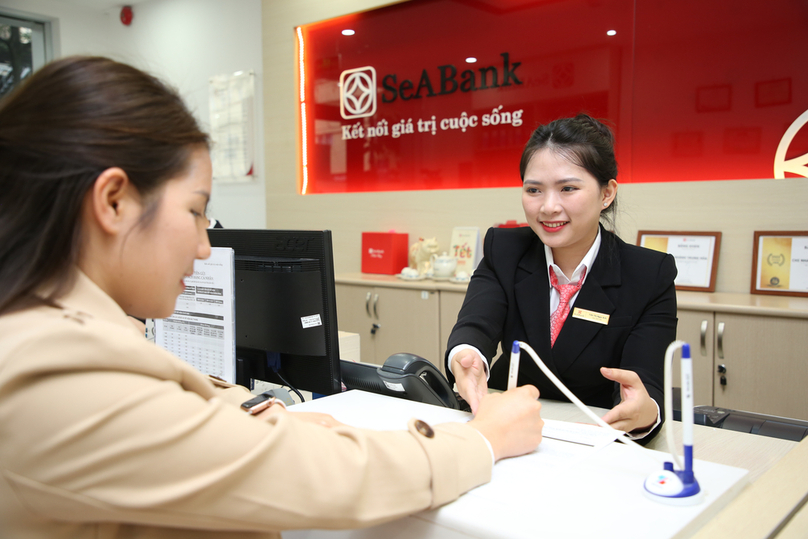 A customer makes transactions at a SeABank office. Photo courtesy of the bank.