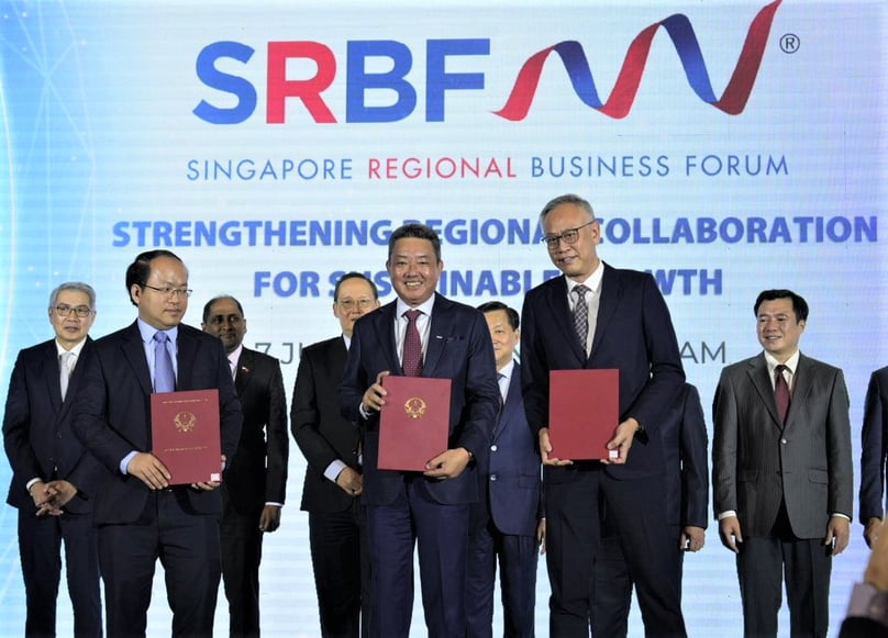 (L-R, front) Vu Quoc Huy, director of Vietnam’s National Innovation Center, Keppel Corporation’s Vietnam chief representative Linson Lim, and Ngee Ann Polytechnic Principal Lim Kok Kiang show their MoUs in Hanoi on July 7, 2023. Photo courtesy of Singapore Regional Business Forum.