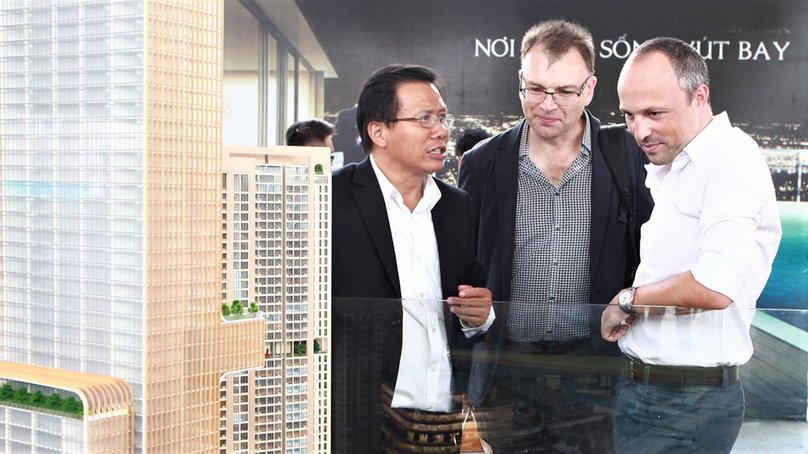 Foreigners study an apartment project in Vietnam. Photo by The Investor/Le Toan.