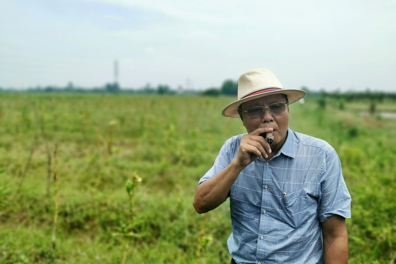 Major General Dang Van Dung on a Cuban cigar field after harvest. Photo by The Investor/Do Hoang.