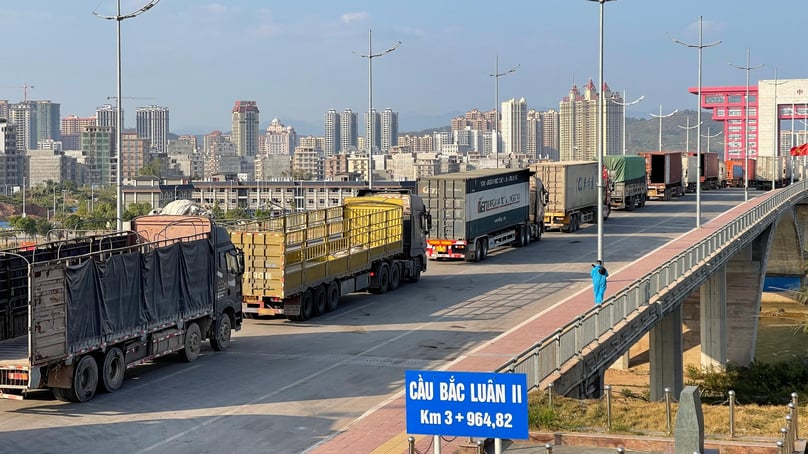 Trucks pass through Bac Luan II bridge, Quang Ninh province, northern Vietnam en route to the border with China. Photo courtesy of Voice of Vietnam newspaper.