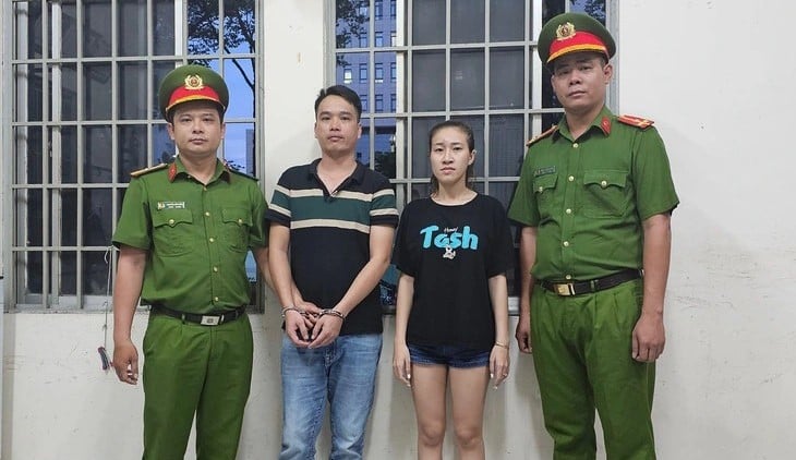 Ha Thuy Van Anh (right) and Nguyen Thanh Liem at the police station. Photo courtesy of Ho CHi Minh City police.