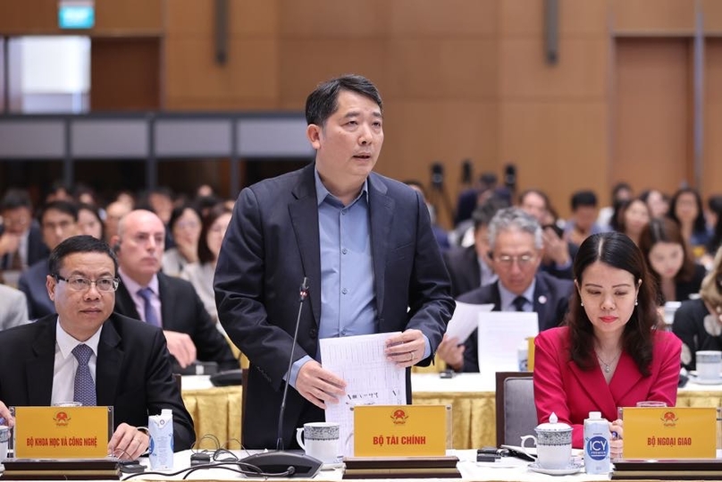 Deputy Minister of Finance Cao Anh Tuan (standing) speaks at a conference in Hanoi on October 16, 2023. Photo courtesy of the government's news portal.