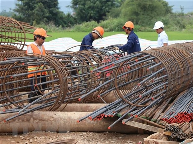 Workers working on the Quang Ngai-Hoai Nhon Expressway project. Photo courtesy of Vietnam News Agency.
