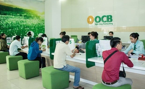 Customers make transactions at an OCB office. Photo courtesy of VietnamPlus.