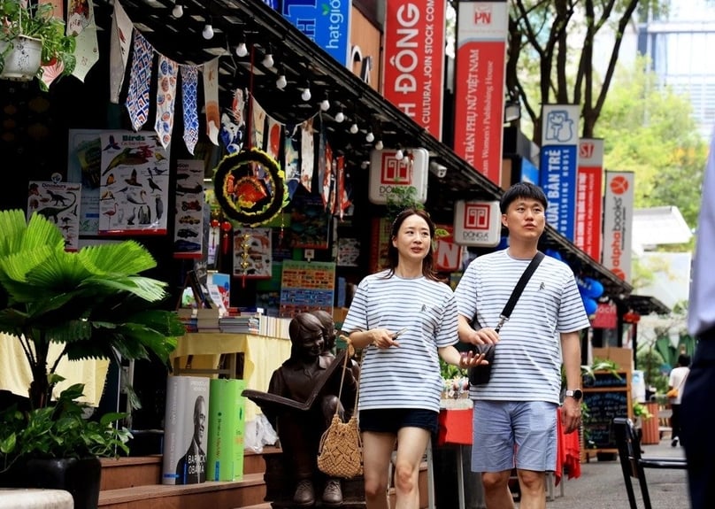 South Korean tourists walk on a street in downtown HCMC. Photo courtesy of the Vietnam News Agency.