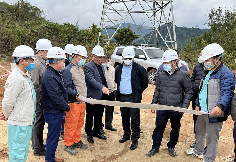 State utility Vietnam Electricity (EVN) leaders inspect the construction of a transmission line project from Laos to Vietnam. Photo courtesy of EVN.