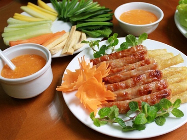 Grilled fermented pork known as nem nuong in Ninh Hoa town, Khanh Hoa province, south-central Vetnam is an unforgettable dish for many, including gourmets. Photo courtesy of mia.vn