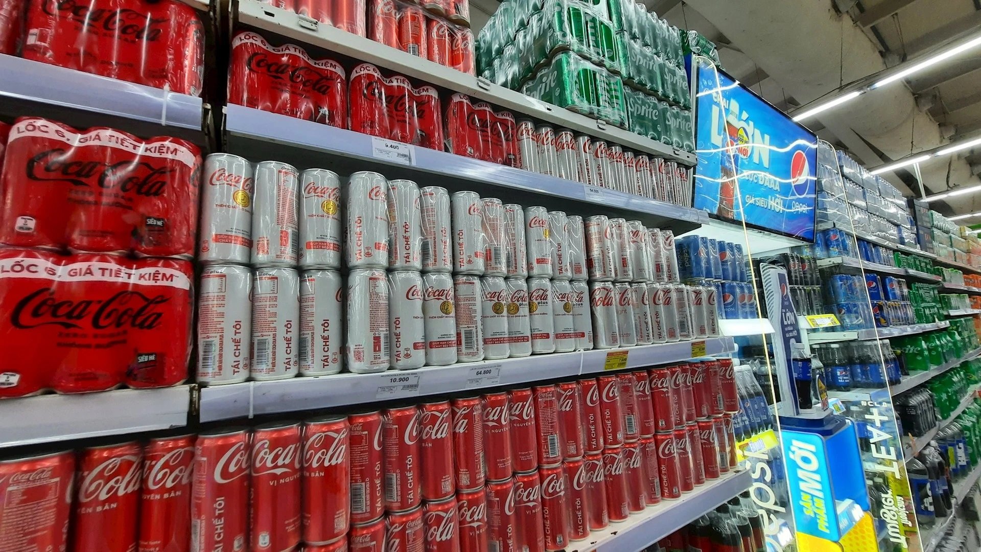 Coca-Cola cans on a supermarket shelf in Hanoi. Photo courtesy of Mekong ASEAN magazine.