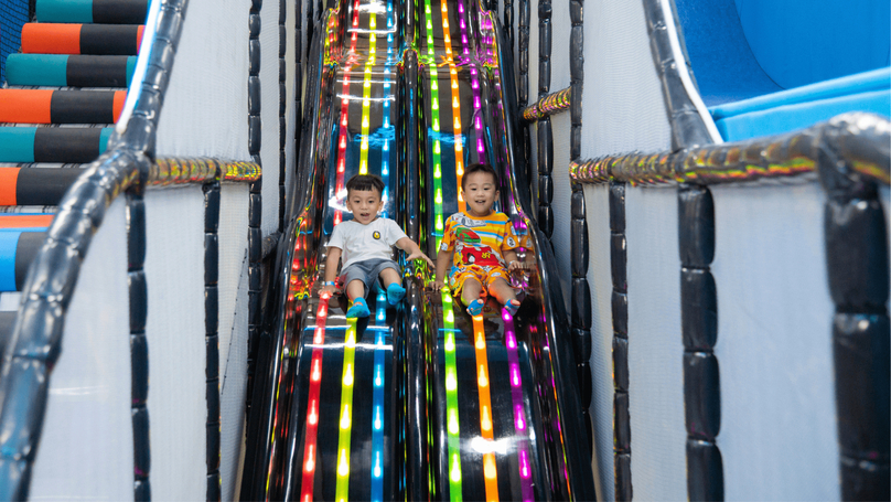 Children enjoy a slide at a tiNiWorld location. Photo courtesy of the company.