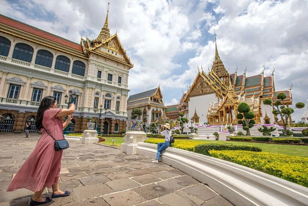 Visitors take photo at the Grand Palace in Bangkok, Thailand. Photo courtesy of Xinhua.