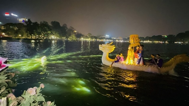 The legend of Le Loi King (1428-1433) returning a magic sword to the golden turtle is the highlight of the night time show. Photo by Vietnam News.
