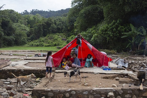 Residents take shelter from flooding in a tent in Koto Sebelas Tarusan district, South Pesisir regency, West Sumatra, March 11, 2024. Photo courtesy of Antara.