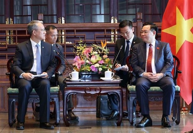 Vietnam’s National Assembly Chairman Vuong Dinh Hue (right) meets with general manager of Power Construction Corporation of China (PowerChina) Wang Bin in Beijing on April 9, 2024. Photo courtesy of Vietnam News Agency.