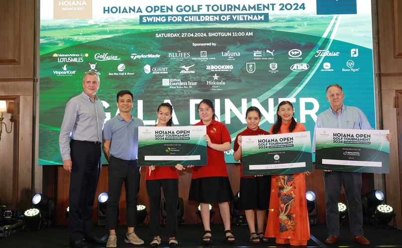 Steven Wolstenholme (first, left), president & CEO of Hoiana Resort & Golf, hands over the fundraising pledges to charitable organizations and funds. Photo courtesy of HSGC.