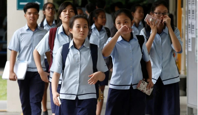  Students walk to classes at a secondary school in Singapore. Photo courtesy of Reuters.