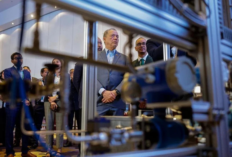 Deputy Prime Minister Fadillah Yusof visits a booth after launching the ASEAN Green Hydrogen Conference 2024. Photo courtesy of Bernama.