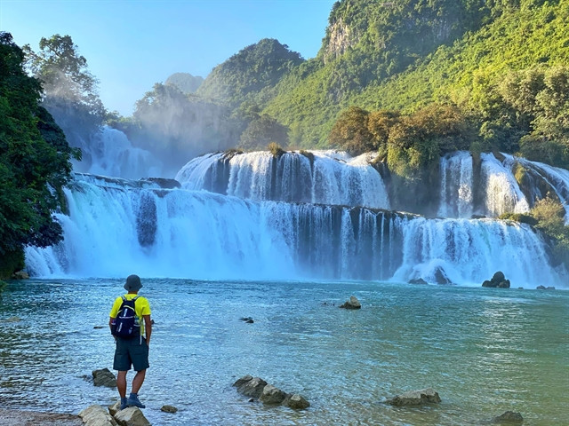 A tourist enjoying the view at Ban Gioc Waterfall in Cao Bang province, northern Vietnam. Photo courtesy of Facebook account Thien Nguyen.