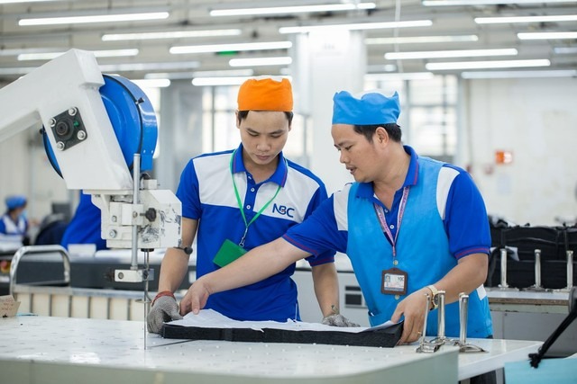 Workers at a company in Vietnam. Photo courtesy of Nguoi Lao Dong (Laborer) newspaper.