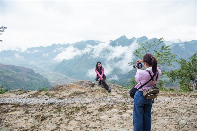 Tourists take photos in Ta Phin commune, Tua Chua district, Dien Bien province, northwestern Vietnam. Photo courtesy of Vietnam News.
