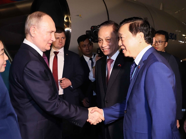 Secretary of the Party Central Committee and head of its External Relations Commission (second right) Le Hoai Trung, and Deputy Prime Minister Tran Hong Ha (first right) welcome Russian President Vladimir Putin upon his arrival in Vietnam early June 20, 2024. Photo courtesy of Vietnam News Agency.