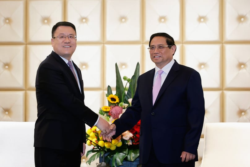Prime Minister Pham Minh Chinh (right) and Wang Xiaojun, deputy general manager of PowerChina, at a meeting in China on June 24, 2024. Photo courtesy of the government's news portal.