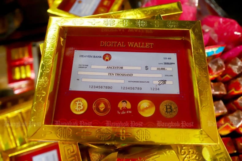 Mock-ups of the controversial digital wallet handout are among ceremonial offerings to be sold to shoppers in Yaowarat as part of the Chinese New Year celebrations on February 8, 2024. Photo courtesy of bangkokpost.com.