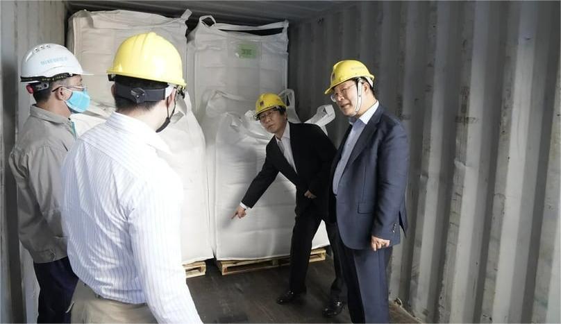 PVFCCo leaders inspect fertilizer products. Photo courtesy of the company.