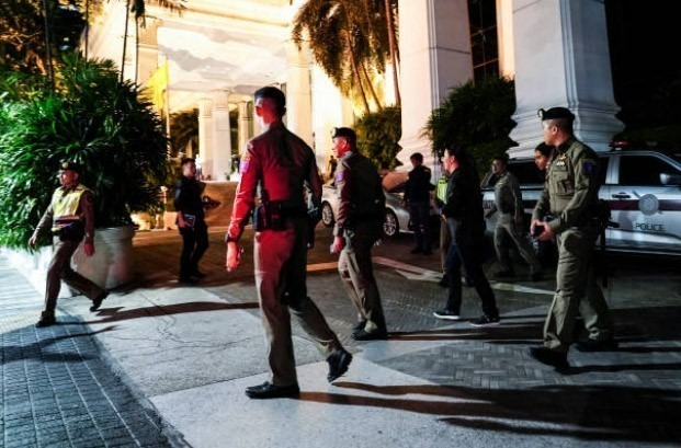 Police at the Grand Hyatt Erawan Hotel in Bangkok on the evening of July 16, 2024, where the bodies were found.