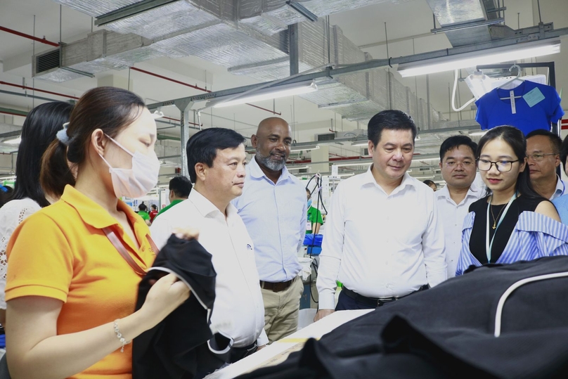 Minister of Industry and Trade Nguyen Hong Dien (fourth, left) and Delta Galil Vietnam CEO Gavin De Silva (third, left) during a factory visit in Binh Dinh province, central Vietnam, August 9, 2024. Photo courtesy of Binh Dinh news portal.