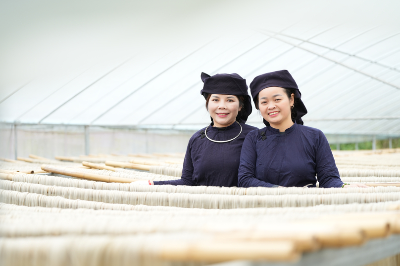  Hoan and an associate at a vermicelli production facility. Photo by Hoang Pham.