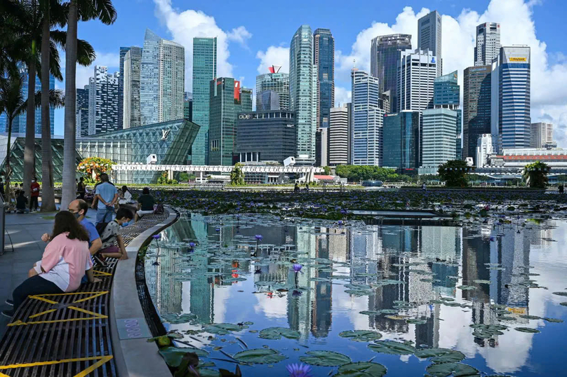 With huge data centers set to drive up already outsized energy demands, the tiny city-state of Singapore is looking to Australia's deserts and Malaysia's rainforests for clean power. Photo courtesy of AFP.