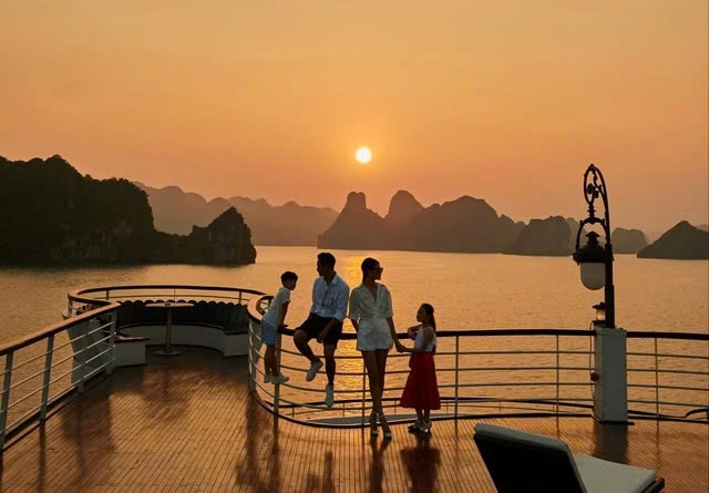 Tourists on a cruise enjoying the sunset in Ha Long Bay, northern Vietnam. Photo courtesy of Thanh Nien (Young People) newspaper.