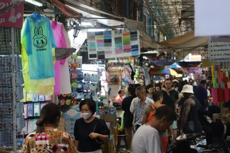 Shoppers stroll around Bangkok's Sampheng market, Thailand during the rainy season. Photo courtesy of bangkokpost.com.