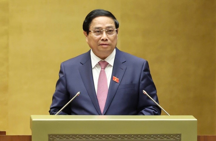 Prime Minister Pham Minh Chinh presents a government report on socio-economic development in 2024-2025 at a National Assembly session in Hanoi, October 21, 2024. Photo courtesy of the government’s news portal.