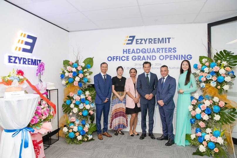 EzyRemit team with the distinguished guests, including Minister Anoulack Chanthivong, Sarah Lee (black T-shirt) and Tania Panagoda (pink vest) from Investment New South Wales (Australia) at the event. Photo courtesy of EzyRemit.