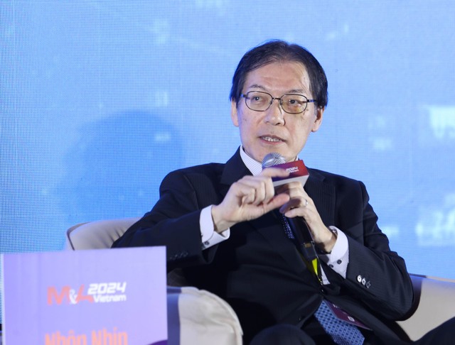 Tamotsu Majima, senior director at Recof Corporation, which specializes in cross-border M&A deals, speaks at a forum in Ho Chi Minh City, November 29, 2024.