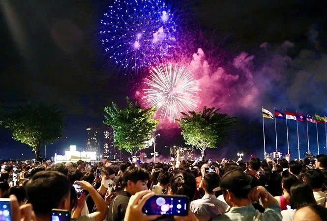 People celebrate New Year's Eve in Ho Chi Minh City, Vietnam. Photo courtesy of Vietnam News Agency.