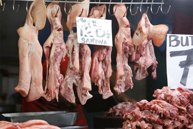 Pork products are up for sale at a public market in Marikina, the Philippines on June 23, 2023. Photo courtesy of Philstar Global.