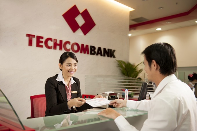 A customer conducts transactions at a branch of Techcombank. Photo courtesy of the lender.