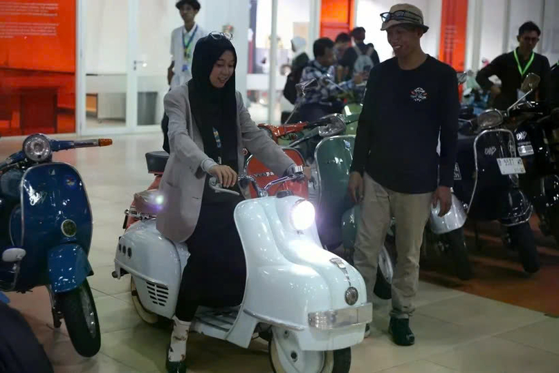 A visitor rides a converted electric motorcycle at Elders Garage in Jakarta. Photo courtesy of Antara.