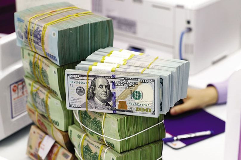 Dollar bills at a bank in Vietnam. Photo courtesy of VietNamNet newspaper.