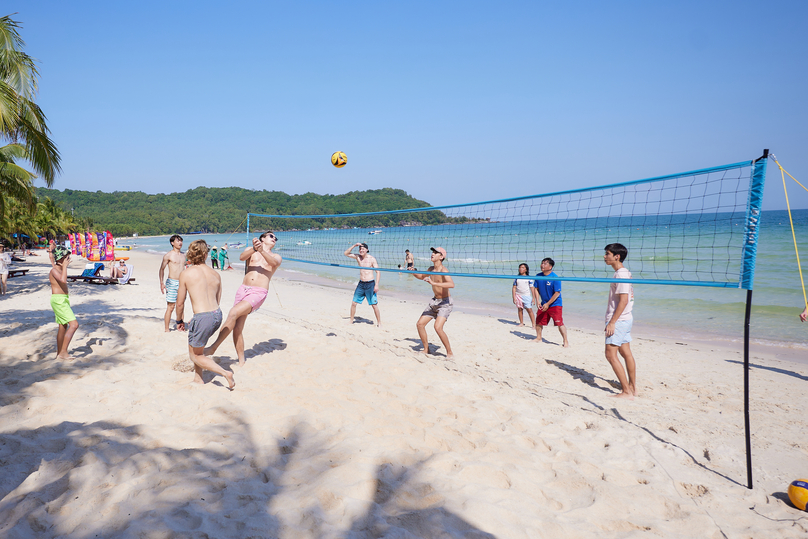 International tourists playing volleyball at Bai Kem – one of the world’s most beautiful beaches in Phu Quoc.